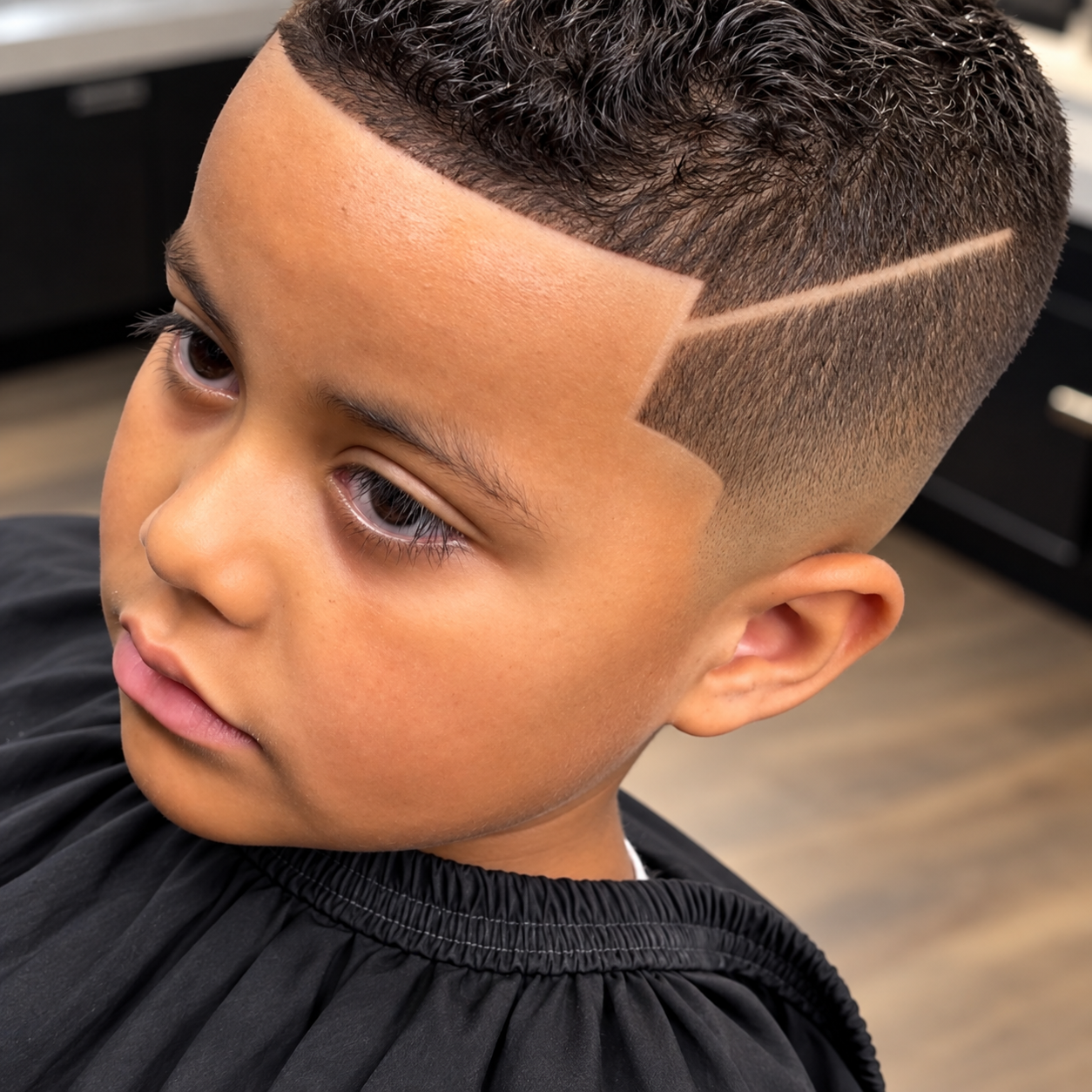 Kids haircut with a clean design at Fade Society